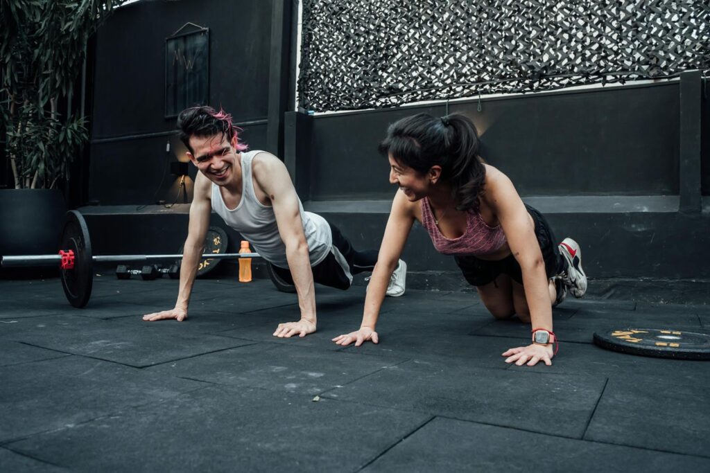 Man and woman doing tiny habit pushups